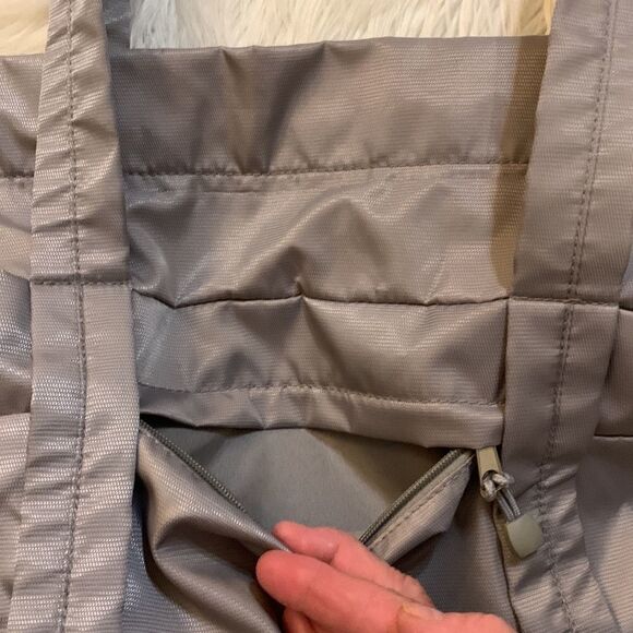 Large gray tote with outside pockets all the way around including one zippered. - Picture 4 of 12